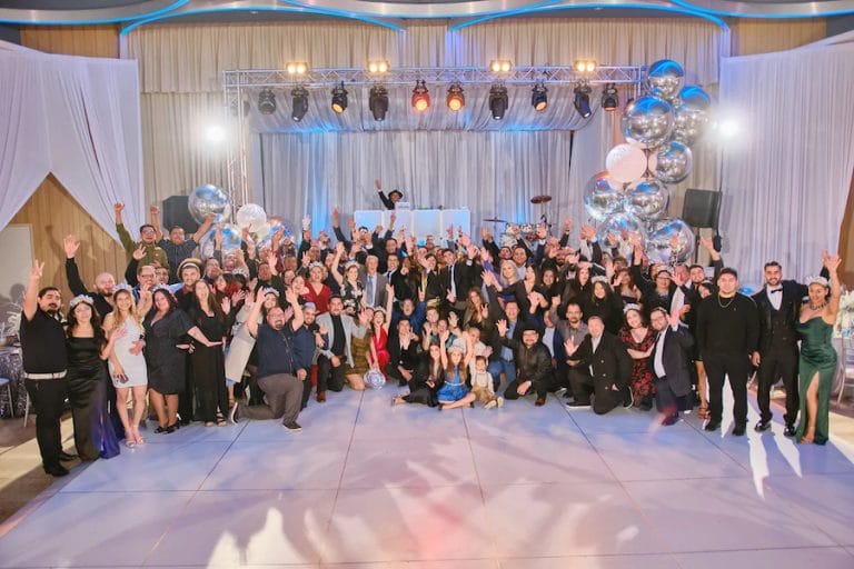 The Powerfull Systems team is depicted in a group picture at a company event.