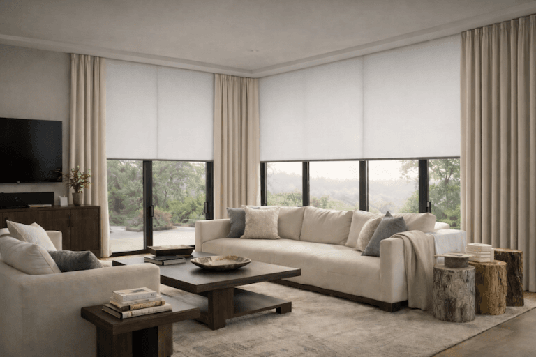 Modern living room with two couches and floor-to-ceiling windows fitted with motorized roller shades diffusing natural light.